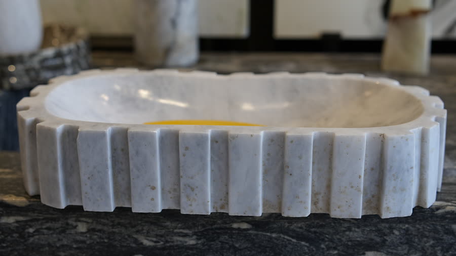 Fluted marble basin. Oval white marble basin with a fluted rim.