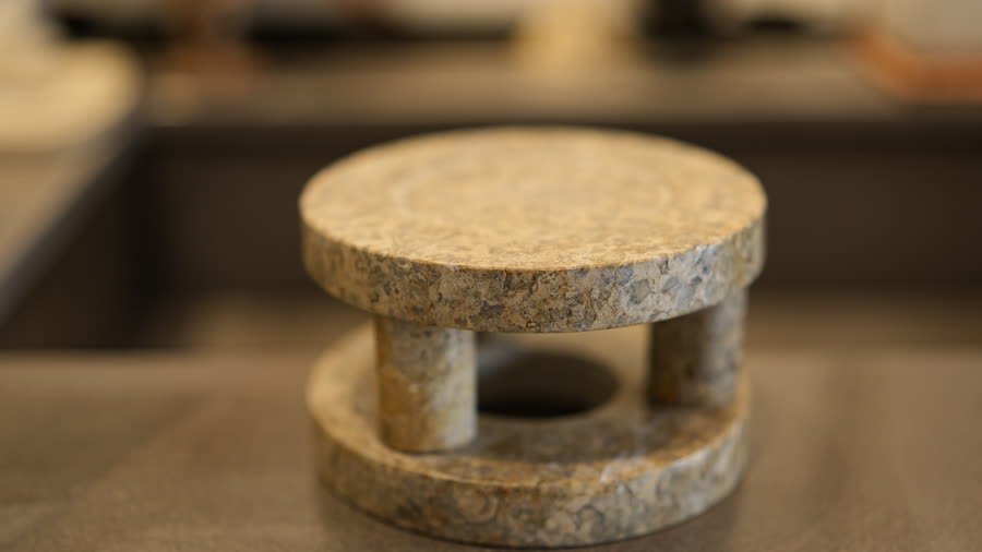 Stone stand. A small granite stand, turned and assembled.