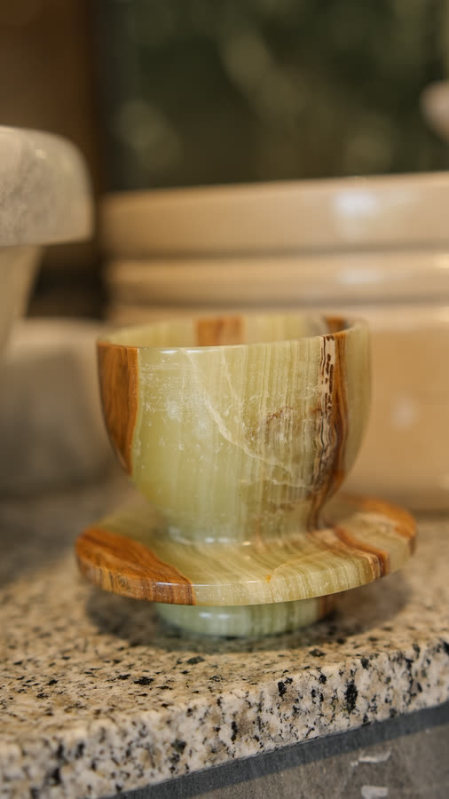 Onyx egg cup. Green onyx egg cup on its saucer.